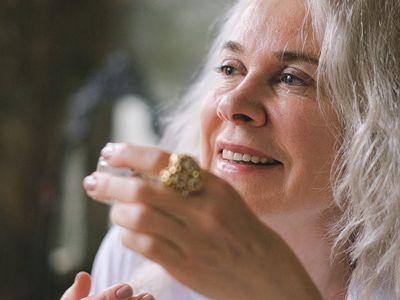 Elegant mature woman smiling indoors